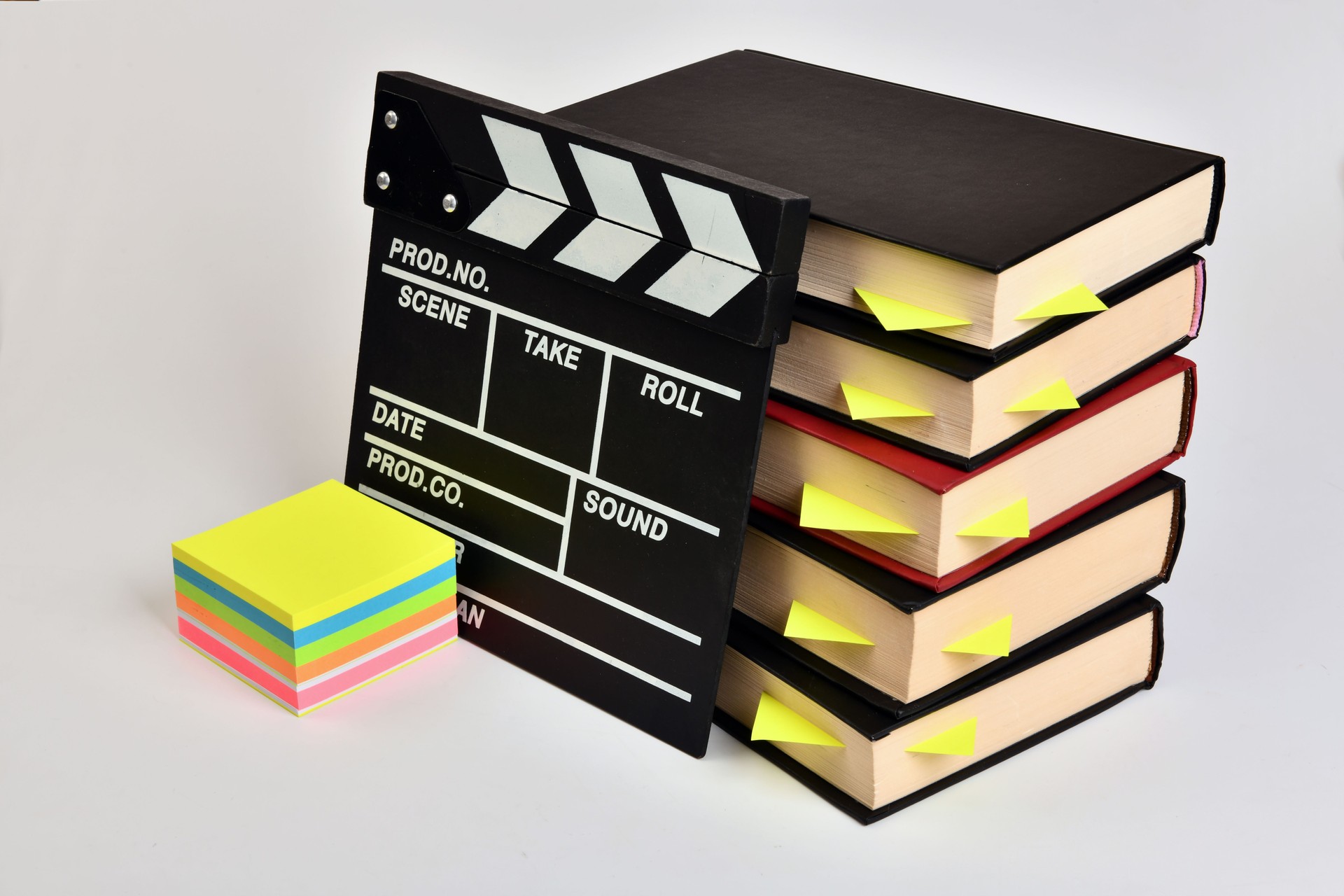 Clapper board and books.